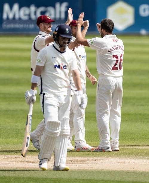 Ben Sanderson of Northamptonshire celebrates with his team mates after taking the wicket of Jordan Thompson of Yorkshire during day three of the LV=...