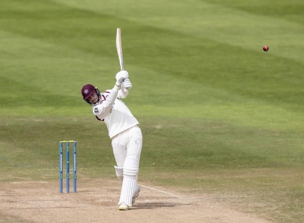 Tom Taylor of Northamptonshire hits the ball to the boundary for four during day three of the LV= Insurance County Championship match between...