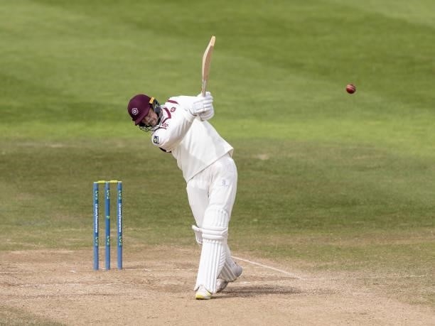 Tom Taylor of Northamptonshire hits the ball to the boundary for four during day three of the LV= Insurance County Championship match between...