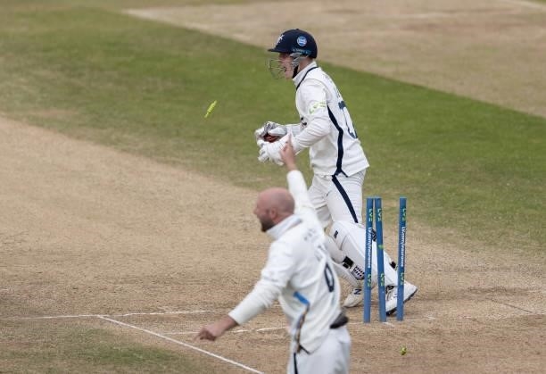 Wicketkeeper Harry Duke and Adam Lyth of Yorkshire celebrate the run out of Wayne Parnell of Northamptonshire by a throw from Jordan Thompson during...