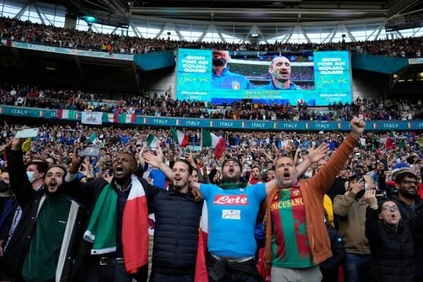 Italy supporters sing their national anthem ahead of the UEFA EURO 2020 semi-final football match between Italy and Spain at Wembley Stadium in...