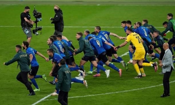 Italy's players celebrate after winning the UEFA EURO 2020 semi-final football match between Italy and Spain at Wembley Stadium in London on July 6,...