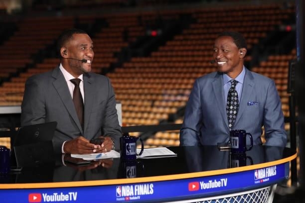 Analysts Steve Smith and Isiah Thomas smile before the game between the Milwaukee Bucks and the Phoenix Suns during Game One of the 2021 NBA Finals...