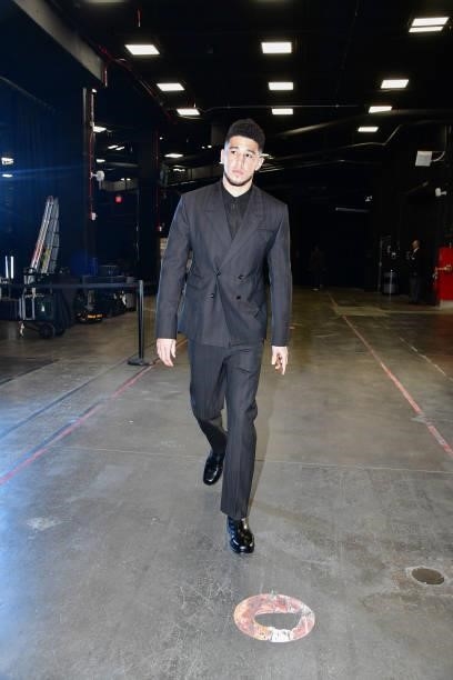 Devin Booker of the Phoenix Suns arrives to the arena before the game against the Milwaukee Bucks during Game One of the 2021 NBA Finals on July 6,...