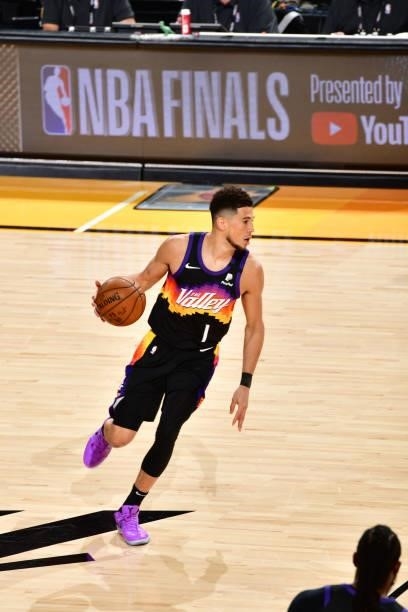Devin Booker of the Phoenix Suns dribbles the ball against the Milwaukee Bucks during Game One of the 2021 NBA Finals on July 6, 2021 at Phoenix Suns...