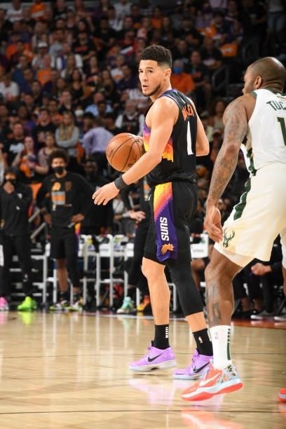 Devin Booker of the Phoenix Suns handles the ball during the game against the Milwaukee Bucks during Game One of the 2021 NBA Finals on July 6, 2021...
