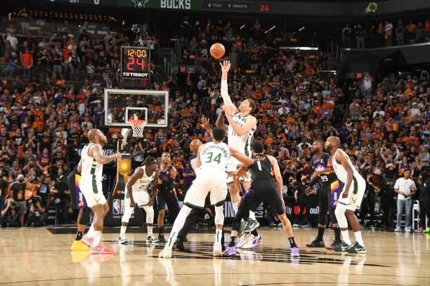 Brook Lopez of the Milwaukee Bucks reaches for the tip off during the game against the Phoenix Suns during Game One of the 2021 NBA Finals on July 6,...