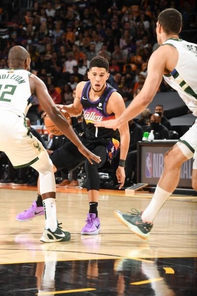 Devin Booker of the Phoenix Suns handles the ball during the game against the Milwaukee Bucks during Game One of the 2021 NBA Finals on July 6, 2021...