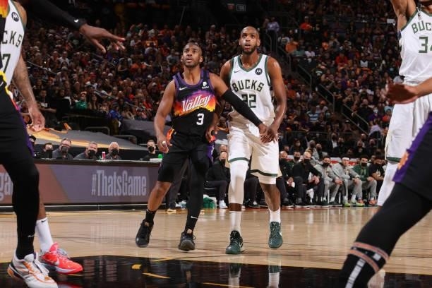 Chris Paul of the Phoenix Suns plays defense on Khris Middleton of the Milwaukee Bucks during Game One of the 2021 NBA Finals on July 6, 2021 at...