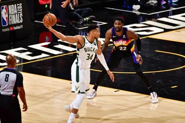 Deandre Ayton of the Phoenix Suns plays defense on Giannis Antetokounmpo of the Milwaukee Bucks during Game One of the 2021 NBA Finals on July 6,...
