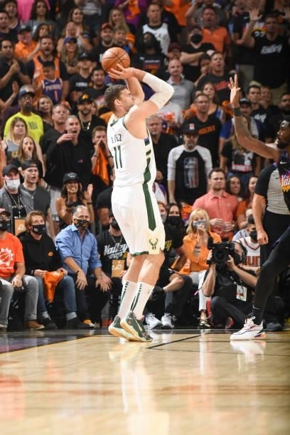 Brook Lopez of the Milwaukee Bucks shoots a three point basket during the game against the Phoenix Suns during Game One of the 2021 NBA Finals on...