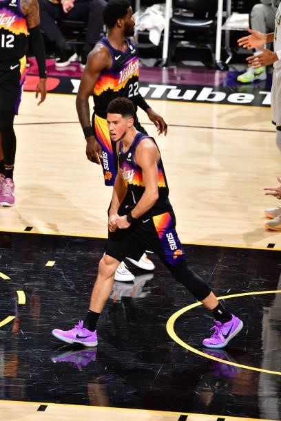 Devin Booker of the Phoenix Suns celebrates against the Milwaukee Bucks during Game One of the 2021 NBA Finals on July 6, 2021 at Phoenix Suns Arena...