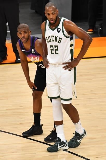 Chris Paul of the Phoenix Suns and Khris Middleton of the Milwaukee Bucks look on during Game One of the 2021 NBA Finals on July 6, 2021 at Phoenix...