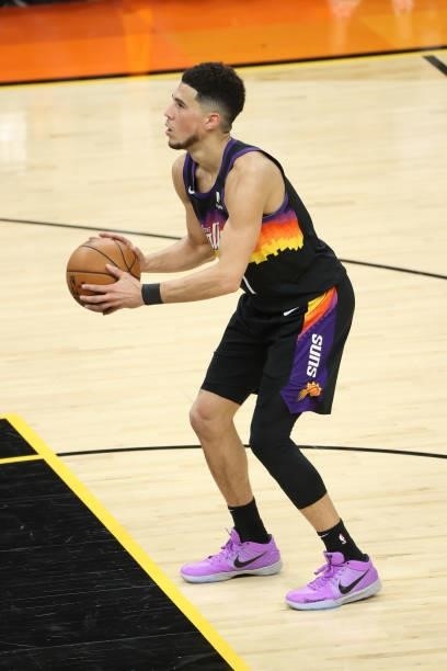 Devin Booker of the Phoenix Suns shoots a free throw during Game One of the 2021 NBA Finals on July 6, 2021 at Phoenix Suns Arena in Phoenix,...