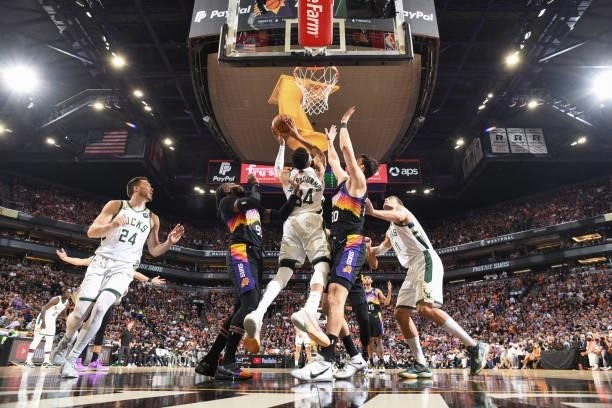 Giannis Antetokounmpo of the Milwaukee Bucks handles the ball during the game against the Phoenix Suns during Game One of the 2021 NBA Finals on July...