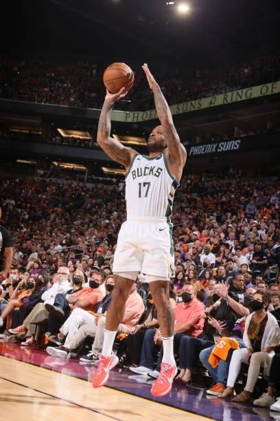 Tucker of the Milwaukee Bucks shoots a three point basket against the Phoenix Suns during Game One of the 2021 NBA Finals on July 6, 2021 at Talking...