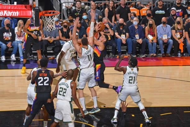 Devin Booker of the Phoenix Suns drives to the basket against the Milwaukee Bucks during Game One of the 2021 NBA Finals on July 6, 2021 at Phoenix...