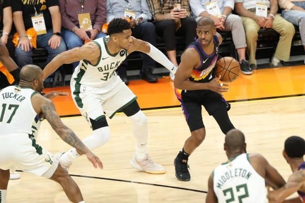 Giannis Antetokounmpo of the Milwaukee Bucks plays defense on Chris Paul of the Phoenix Suns during Game One of the 2021 NBA Finals on July 6, 2021...