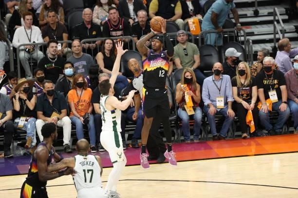 Torrey Craig of the Phoenix Suns shoots a three point basket against the Milwaukee Bucks during Game One of the 2021 NBA Finals on July 6, 2021 at...