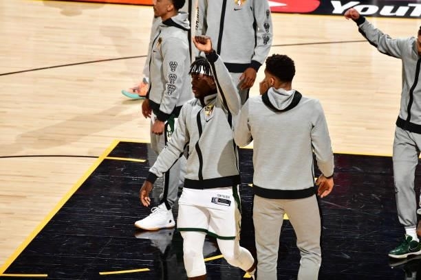 Jrue Holiday and Giannis Antetokounmpo of the Milwaukee Bucks high five before the game against the Phoenix Suns during Game One of the 2021 NBA...