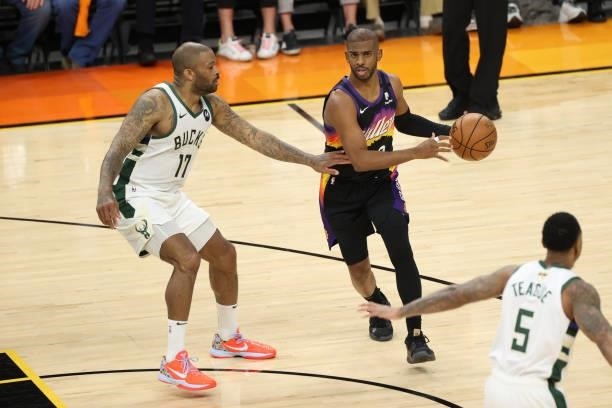 Tucker of the Milwaukee Bucks plays defense on Chris Paul of the Phoenix Suns during Game One of the 2021 NBA Finals on July 6, 2021 at Phoenix Suns...