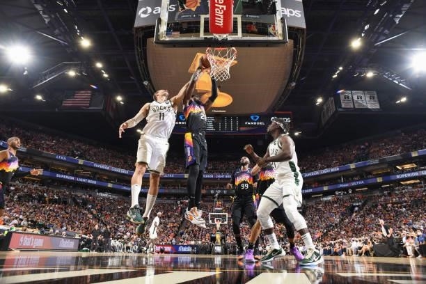 Deandre Ayton of the Phoenix Suns and Brook Lopez of the Milwaukee Bucks fight for the rebound during Game One of the 2021 NBA Finals on July 6, 2021...