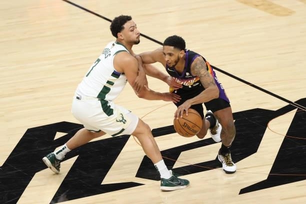 Bryn Forbes of the Milwaukee Bucks plays defense on Cameron Payne of the Phoenix Suns during Game One of the 2021 NBA Finals on July 6, 2021 at...