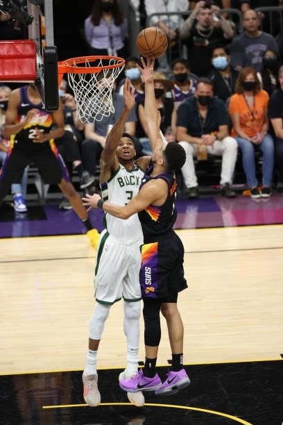 Giannis Antetokounmpo of the Milwaukee Bucks plays defense on Devin Booker of the Phoenix Suns during Game One of the 2021 NBA Finals on July 6, 2021...