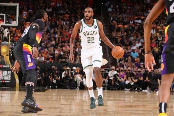 Khris Middleton of the Milwaukee Bucks dribbles the ball against the Phoenix Suns during Game One of the 2021 NBA Finals on July 6, 2021 at Talking...