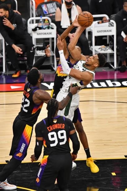 Giannis Antetokounmpo of the Milwaukee Bucks passes the ball against the Phoenix Suns during Game One of the 2021 NBA Finals on July 6, 2021 at...