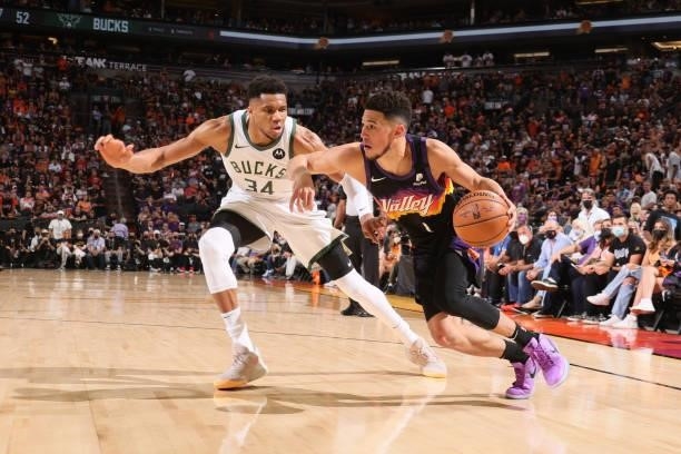 Devin Booker of the Phoenix Suns drives to the basket against the Milwaukee Bucks during Game One of the 2021 NBA Finals on July 6, 2021 at Talking...