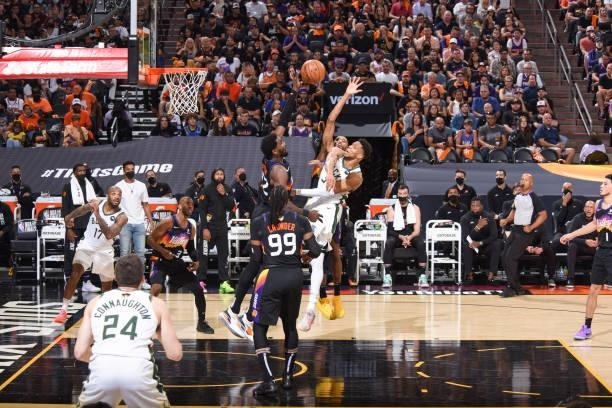 Giannis Antetokounmpo of the Milwaukee Bucks passes the ball during the game against the Phoenix Suns during Game One of the 2021 NBA Finals on July...