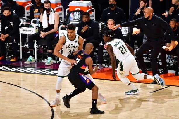 Chris Paul of the Phoenix Suns plays defense on Jrue Holiday of the Milwaukee Bucks during Game One of the 2021 NBA Finals on July 6, 2021 at Phoenix...