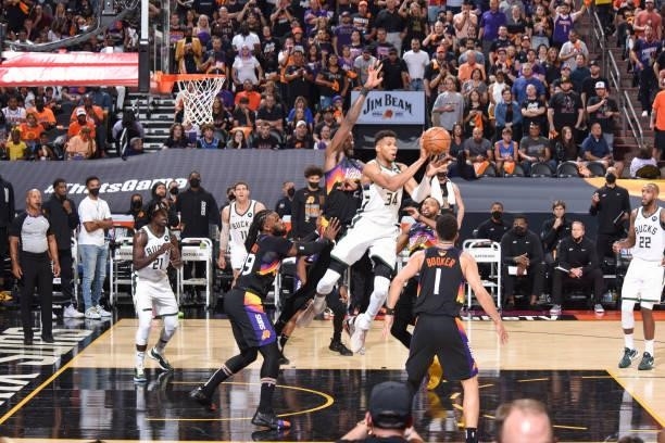 Giannis Antetokounmpo of the Milwaukee Bucks looks to pass the ball during the game against the Phoenix Suns during Game One of the 2021 NBA Finals...