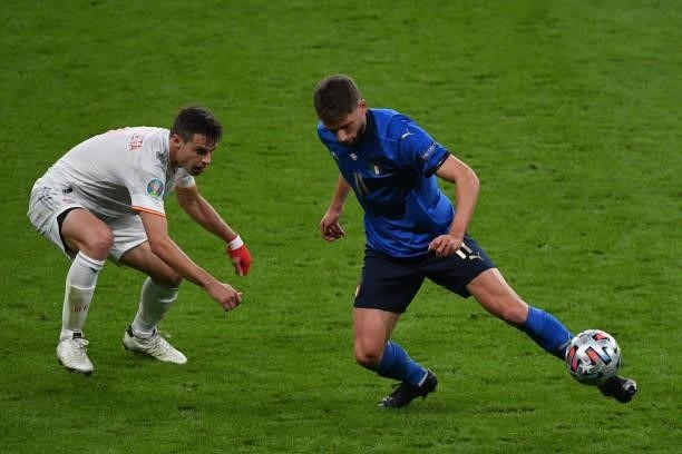 Domenico Berardi of Italy keeps the ball under pressure from Cesar Azplliqueta of Spain during the UEFA Euro 2020 Championship Semi-final match...
