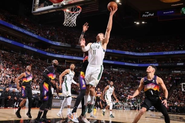 Brook Lopez of the Milwaukee Bucks shoots the ball against the Phoenix Suns during Game One of the 2021 NBA Finals on July 6, 2021 at Talking Stick...