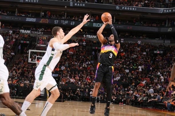Chris Paul of the Phoenix Suns shoots a three point basket against the Milwaukee Bucks during Game One of the 2021 NBA Finals on July 6, 2021 at...