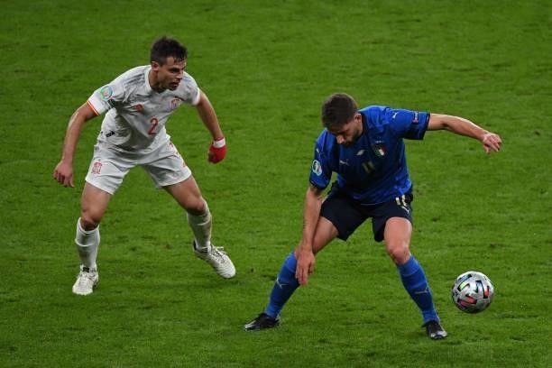 Domenico Berardi of Italy keeps the ball under pressure from Cesar Azplliqueta of Spain during the UEFA Euro 2020 Championship Semi-final match...