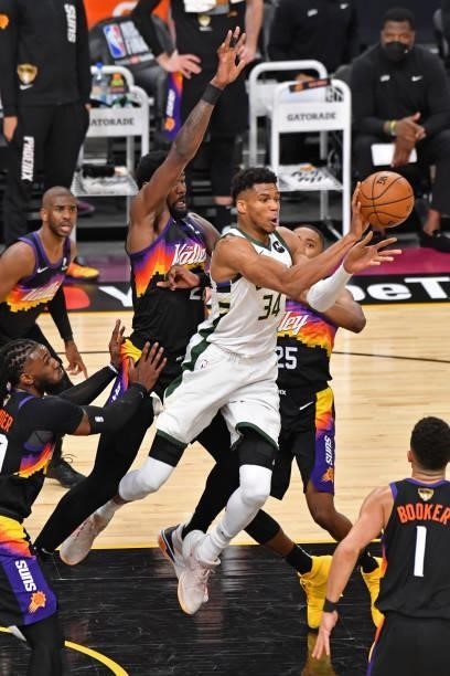 Giannis Antetokounmpo of the Milwaukee Bucks drives to the basket and passes the ball against the Phoenix Suns during Game One of the 2021 NBA Finals...