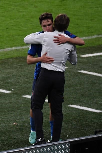 Roberto Mancini, coach of Italy hugs Federico Chiesa who sores the opener during the UEFA Euro 2020 Championship Semi-final match between Italy and...