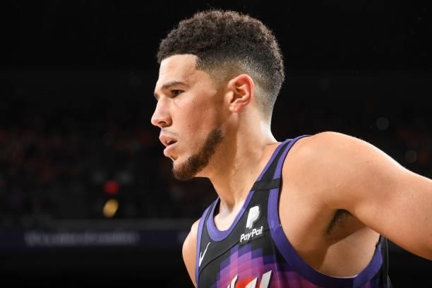 Devin Booker of the Phoenix Suns looks on during the game against the Milwaukee Bucks during Game One of the 2021 NBA Finals on July 6, 2021 at...
