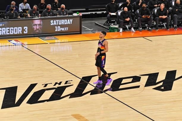 Devin Booker of the Phoenix Suns stands at center court against the Milwaukee Bucks during Game One of the 2021 NBA Finals on July 6, 2021 at Phoenix...
