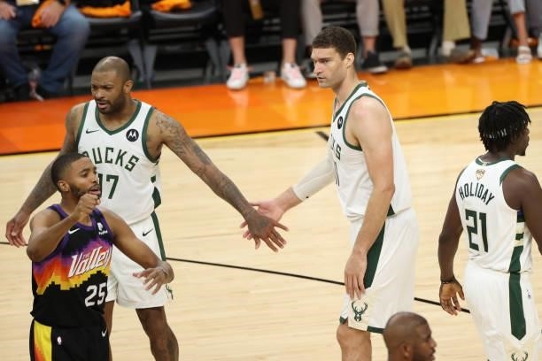 Tucker hi-fives Brook Lopez of the Milwaukee Bucks during Game One of the 2021 NBA Finals on July 6, 2021 at Phoenix Suns Arena in Phoenix, Arizona....