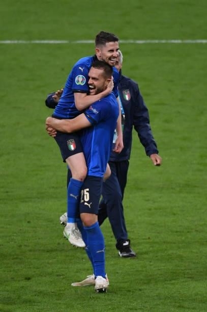 Jorginho of Italy haugs Rafael Tolol of Italy to celebrate the win over Spain at penalty shoot out during the UEFA Euro 2020 Championship Semi-final...