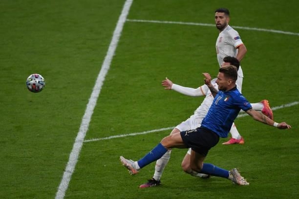 Domenico Berardi of Italy shoots the ball under the challenge from Aymeric Laporte of Spain during the UEFA Euro 2020 Championship Semi-final match...
