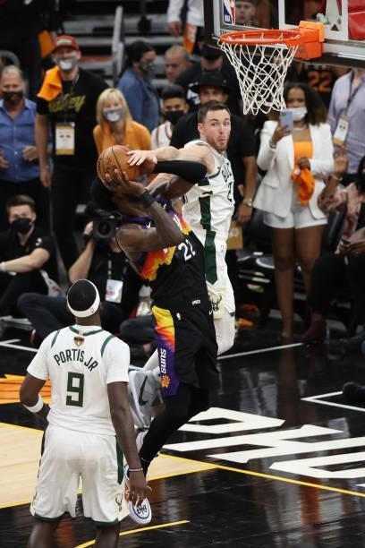 Pat Connaughton of the Milwaukee Bucks attempts to block the ball during Game One of the 2021 NBA Finals on July 6, 2021 at Phoenix Suns Arena in...