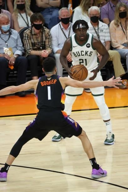 Devin Booker of the Phoenix Suns plays defense on Jrue Holiday of the Milwaukee Bucks during Game One of the 2021 NBA Finals on July 6, 2021 at...