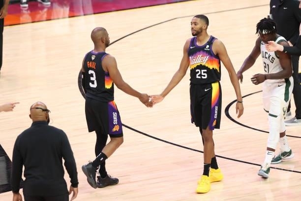 Mikal Bridges hi-fives Chris Paul of the Phoenix Suns during Game One of the 2021 NBA Finals on July 6, 2021 at Phoenix Suns Arena in Phoenix,...
