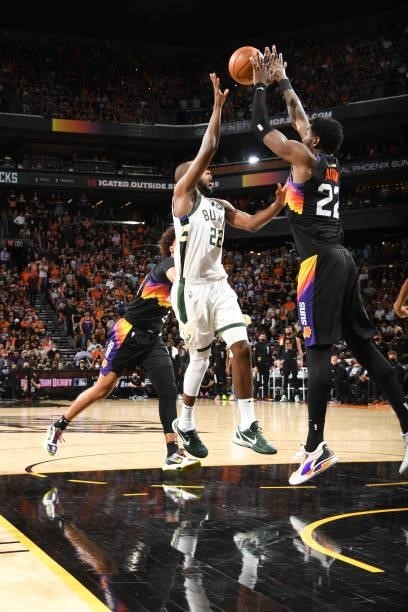 Deandre Ayton of the Phoenix Suns blocks Khris Middleton of the Milwaukee Bucks during the game during Game One of the 2021 NBA Finals on July 6,...