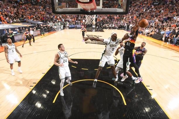 Bobby Portis of the Milwaukee Bucks and Deandre Ayton of the Phoenix Suns fight for the rebound during Game One of the 2021 NBA Finals on July 6,...